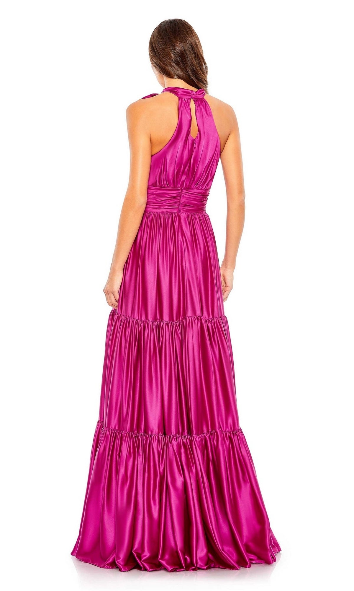 A woman faces away, wearing the Mac Duggal High-Neck Satin Formal Dress 506581, a bright pink satin gown featuring a halter neckline and tiered A-line skirt.